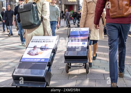 Jehovah's Witnesses with mobile information stands, with information in various languages, in the pedestrian zone at Cologne Cathedral Stock Photo