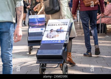 Jehovah's Witnesses with mobile information stands, with information in various languages, in the pedestrian zone at Cologne Cathedral Stock Photo