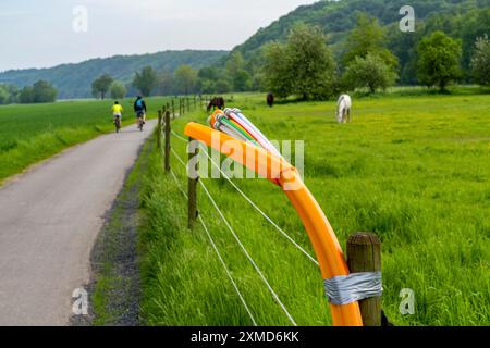 Fibre optic cable, freshly laid along a dirt track, at a paddock, awaiting further expansion, extension, provision of high-speed Internet in rural Stock Photo