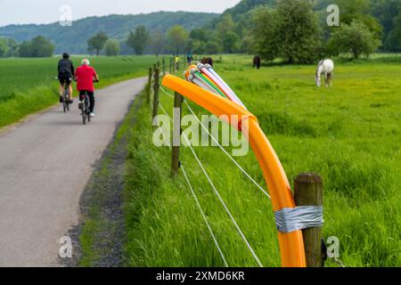 Fibre optic cable, freshly laid along a dirt track, at a paddock, awaiting further expansion, extension, provision of high-speed Internet in rural Stock Photo