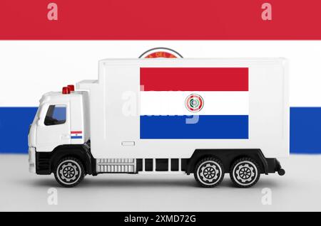 Paraguay flag depicted on side wall of white delivery van close up. Shipping and local delivery concept Stock Photo