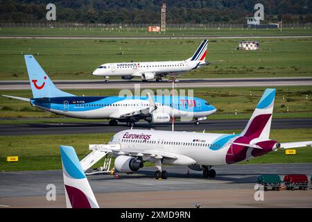 Duesseldorf Airport, TUIfly Boeing 737, Eurowings aircraft at the outer position, parking position, Airfrance Hop. Embraer ERJ-190 after landing Stock Photo