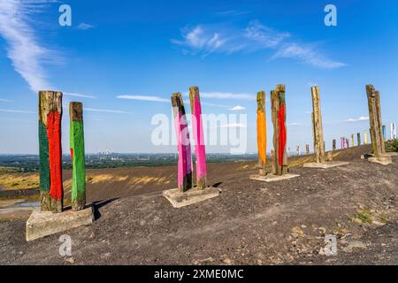 The Haniel spoil tip, 185 metre high spoil tip at the Prosper Haniel mine, which was closed in 2019, artwork Totems by the sculptor Augustin Stock Photo