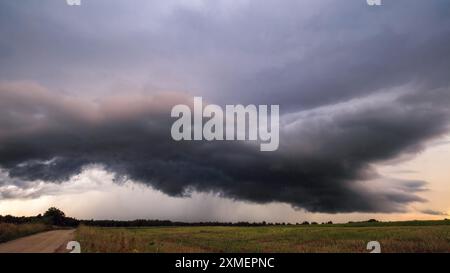 Storm clouds over field, extreme weather, dangerous storm Stock Photo