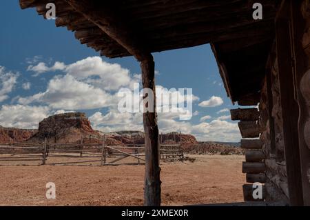 Log cabin and corral (or perhaps an old movie set) on the Ghost Ranch of New Mexico Stock Photo