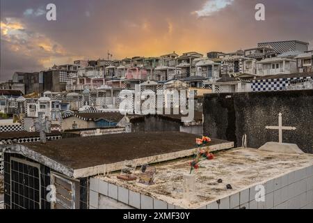 Cemetery, Mausoleums Or Large Crypts Decorated With Tiles, Often In Black And White. Densely Built Buildings Under A Sunset Cimetière De Morne-à-l'eau Stock Photo