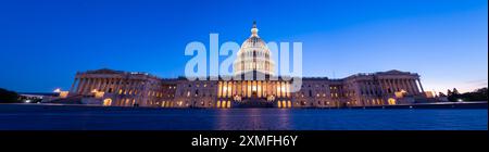 Wide Angle Panorama of the US Capitol at Night with all Lights on and clear skies Stock Photo