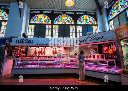 Inside the famous Salamanca Central Market, a food market hall with stained glass windows, butcher shop, art nouveau architecture in Salamanca, Spain. Stock Photo