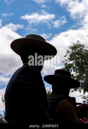 Pilgrims on horseback approach through the sands of the Doñana National Park to their destination in the village of El Rocio in Almonte Stock Photo