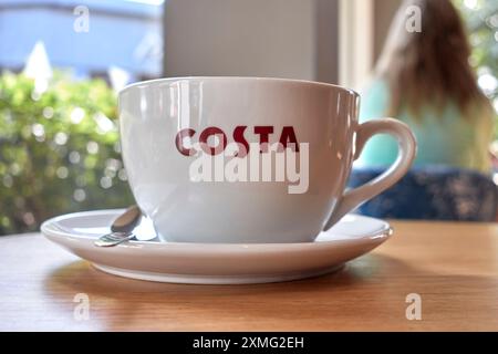Costa Coffee cup on a table at the Costa Coffee cafe, Maybird Center, Stratford upon Avon, England UK Stock Photo