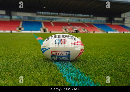 Salford, Manchester, UK. 27th July, 2024. Super League Rugby: Salford Red Devils Vs Castleford Tigers at Salford Community Stadium. Rugby League ball on the pitch with the blue 20m line for the inclusion fixture to raise awareness of colour blindness. Credit James Giblin/Alamy Live News. Stock Photo