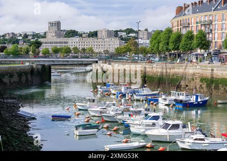 Le Havre, France - The Roy Basin with small fishing boats at anchor and in the background buildings typical of the reconstruction of the city. Stock Photo