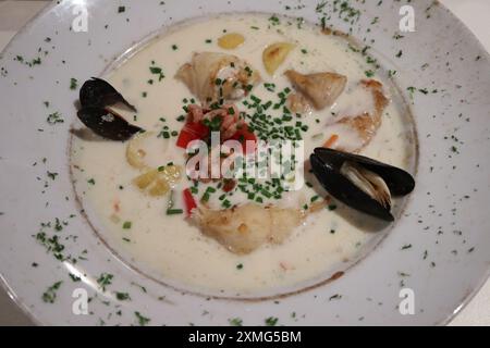 Waterzooi (chicken stew in cream), Belgian local food, at a restaurant in Bruges, Belgium Stock Photo