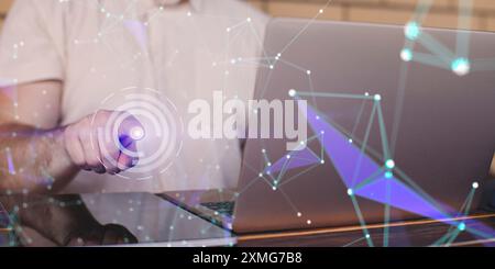 Businessman using laptop with abstract network hologram in office. Stock Photo