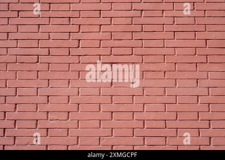 Background from a wall made of red painted bricks Stock Photo