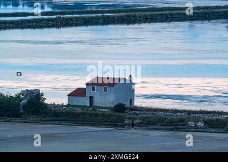 Salt pans at last sun rays Stock Photo