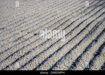 Japanese ZEN garden with a stone in the sand Stock Photo