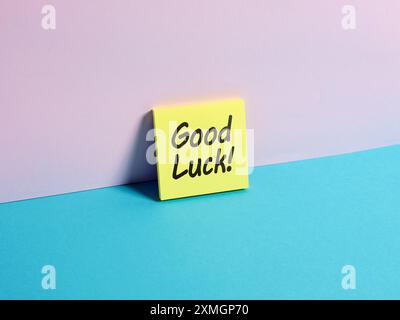 Wishing good luck. The message Good Luck on a sticky note paper. Stock Photo