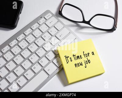 Career change, new career goals and the decision to search for a new job. The message its time for a new job written on a sticky note paper. Stock Photo
