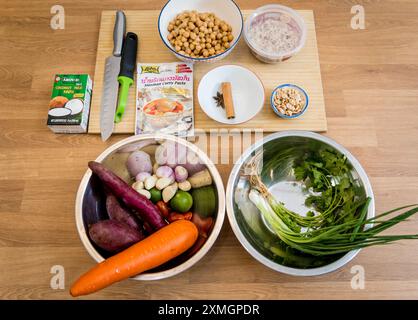 Cutting board with ingredients for preparing massaman curry Stock Photo