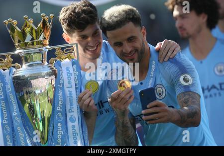 Manchester City players secebrate  winning the Premier League trophy after the English Premier League match between Brighton and Hove Albion and Manchester City in Brighton, Britain, 12 May 2019 Stock Photo