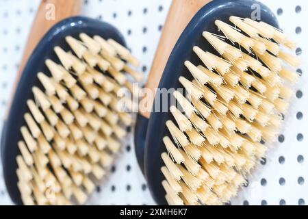 Two brushes with white bristles and black handles. One is on the left and the other on the right Stock Photo