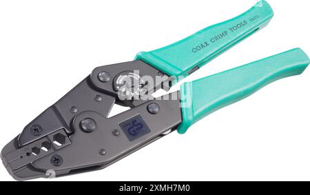 Universal crimping and stripping pliers with green  handles, isolated on white background Stock Photo