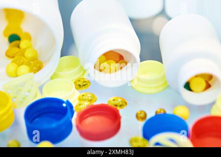 Plastic pill jars and vitamins Stock Photo