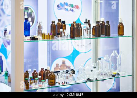 Laboratory glass dishes, bottles, jars and flasks in store Stock Photo