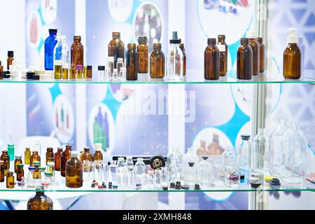 Laboratory glass dishes, bottles, jars and flasks in store Stock Photo