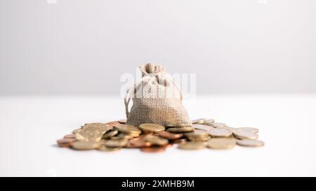 Effective finance management involves strategic investment and saving practices to foster growth in money, with careful accounting of coins and curren Stock Photo