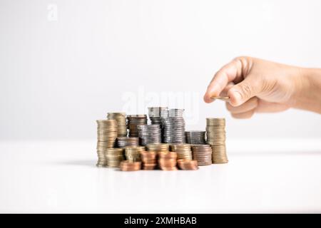 Effective finance management involves strategic investment and saving practices to foster growth in money, with careful accounting of coins and curren Stock Photo