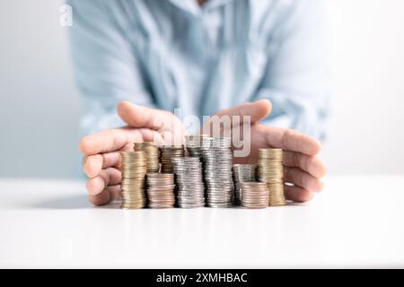 Effective finance management involves strategic investment and saving practices to foster growth in money, with careful accounting of coins and curren Stock Photo