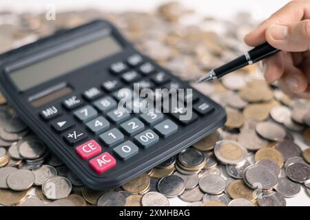 Effective finance management involves strategic investment and saving practices to foster growth in money, with careful accounting of coins and curren Stock Photo