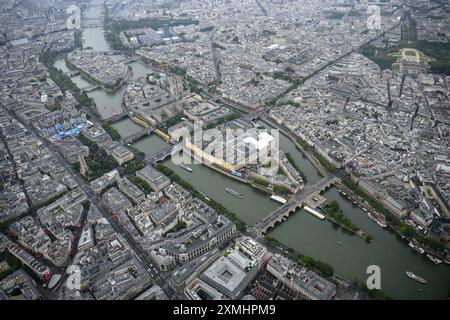 Paris, France. 26th July, 2024. This photo taken from an helicopter on July 26, 2024 shows an aerial view of the delegation boats navigating down the Seine river past Ile de la Cite during the opening ceremony of the Paris 2024 Olympic Games in Paris, France. Credit: Lionel Bonaventure/POOL/Xinhua/Alamy Live News Stock Photo