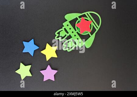 Rocket and stars, success in solving missions developed as a team Stock Photo