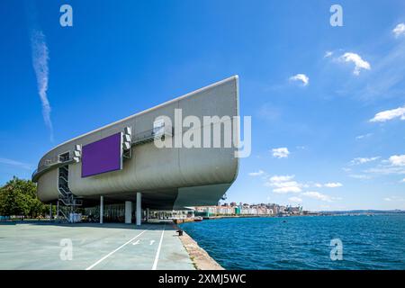 Modern building of the Botin art center in the foreground, on the promenade of the port of Santander, Cantabria, Spain with nice daylight Stock Photo