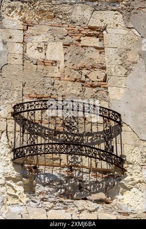 Rustic Balcony on Weathered Stone Wall Stock Photo