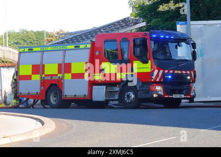 A Volvo fire engine pump in use by West Yorkshire Fire & Rescue at a building fire in Leeds. Stock Photo