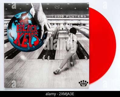 LP cover and red vinyl of Ohio Players, the 12th studio album by rock duo The Black Keys, which was released in 2024 Stock Photo