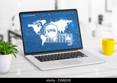 VPN web page service on laptop display displaying a world map with VPN locations. Highlights global network access, online security, and privacy prote Stock Photo