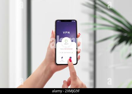 Starting a VPN connection on a smartphone. Emphasizes mobile online security, privacy protection, and secure internet access in a modern digital conte Stock Photo