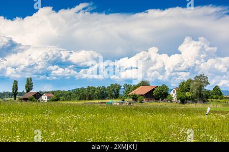 Marthalen, Switzerland, 20th May 2024: A storm is raging behind the farms in southern Germany and the Swiss canton of Schaffhausen. The sun is shining Stock Photo