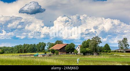 Marthalen, Switzerland, 20th May 2024: A storm is raging behind the farms in southern Germany and the Swiss canton of Schaffhausen. The sun is shining Stock Photo