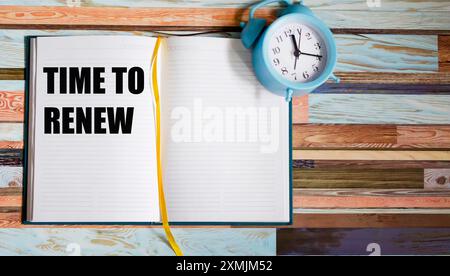 Time to Renew, text on a notepad, next to the alarm clock. Business concepts, strategy, plans and goals. Stock Photo