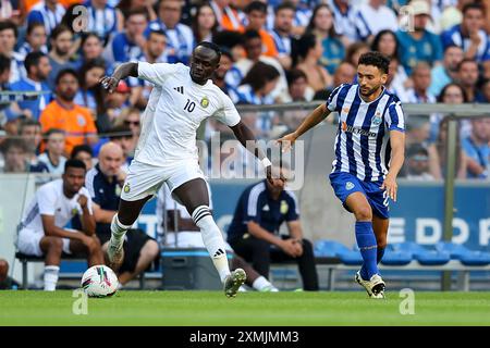 FC Porto vs Al Nassr, Oporto, Dragon Stadium, Portugal. 28 July, 2024. Pictured left to right, Sadio Mané (Al Nassr Player), João Mário (FC Porto Player), during the presentation match of the Portuguese team FC Porto. Credit: Victor Sousa/Alamy Live News Stock Photo