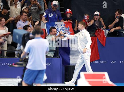 Paris, France. July 28th 2024. France's Leon Marchand celebrates winning the gold medal in the men's 400m individual medley final, in the Paris La Defense Arena. During day two of the Paris Olympic Games 2024, Paris, France. Credit: Isabel Infantes/Alamy Live News Stock Photo