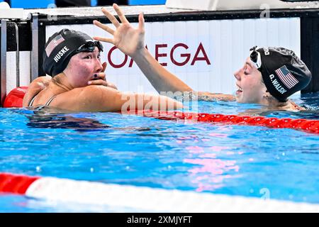 Paris, France. 28th July, 2024. Torri Huske of United States of America, gold, and Gretchen Walsh of United States of America, silver react after the swimming 100m Butterfly Women Final during the Paris 2024 Olympic Games at La Defense Arena in Paris (France), July 28, 2024. Credit: Insidefoto di andrea staccioli/Alamy Live News Stock Photo