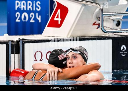 Paris, France. 28th July, 2024. Torri Huske of United States of America, gold, and Gretchen Walsh of United States of America, silver react after the swimming 100m Butterfly Women Final during the Paris 2024 Olympic Games at La Defense Arena in Paris (France), July 28, 2024. Credit: Insidefoto di andrea staccioli/Alamy Live News Stock Photo