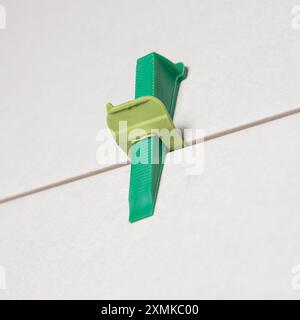 Tile leveling system with plastic clips and wedges Stock Photo